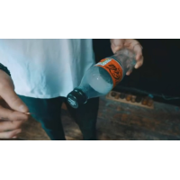 Slo Mo Coin in Bottle by Lloyd Barnes