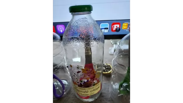 Scissors Inside Bottle by Mark R. Gladue