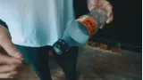 Slo Mo Coin in Bottle by Lloyd Barnes
